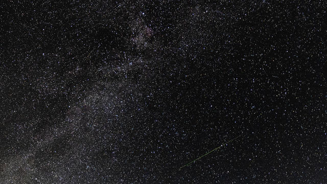 A meteor streaks across the sky during the Perseids meteor shower at Pedernales Falls State Park on August 13, 2023 in Johnson City, Texas. 