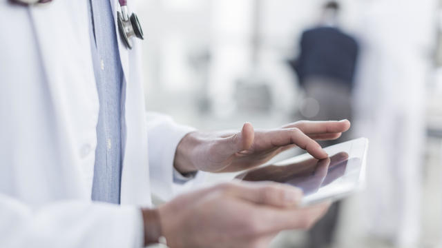 Close-up of doctor using a digital tablet 