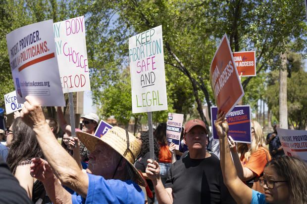 Members of Arizona for Abortion Access, the ballot initiative to enshrine abortion rights in the Arizona state constitution, hold a press conference and protest on April 17, 2024, in Phoenix. 