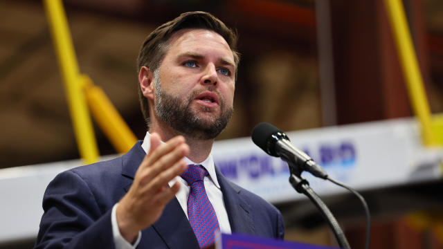 Senator and Republican vice presidential candidate J.D. Vance greets the crowd after speaking about the economy at Majestic Friesians Horse Farms in Big Rapids, Michigan, on August 27, 2024. 