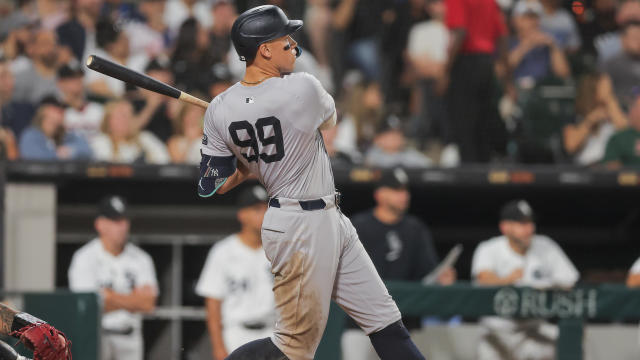 Aaron Judge #99 of the New York Yankees watches his 300th home run of his career during the eight inning of a baseball game against the Chicago White Sox on August 14, 2024 at Guaranteed Rate Field in Chicago, Illinois. 