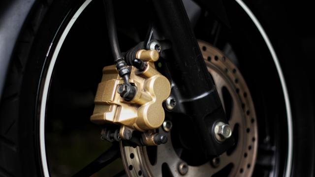 Close-Up Of Disc Brake Of Motorcycle 