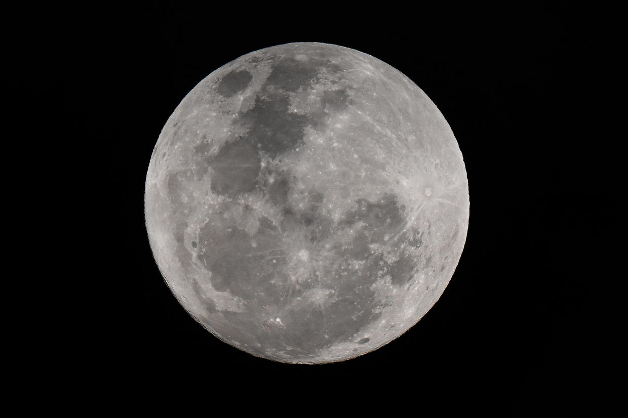 Photos of the blue supermoon show August's rare lunar phenomenon light