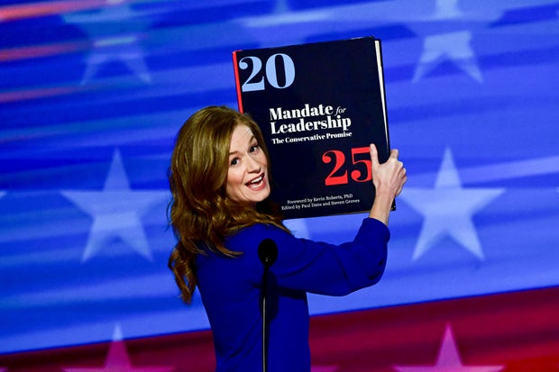 State Sen. Mallory McMorrow, a Democrat from Michigan, holds up a Project 2025 book during the Democratic National Convention at the United Center in Chicago on Monday, Aug. 19, 2024.