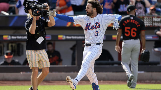 Jesse Winker #3 of the New York Mets reacts as he rounds third base after hitting a walk off homerun in the bottom of the ninth inning to defeat the Baltimore Orioles 4-3 at Citi Field on August 21, 2024 in New York City. 