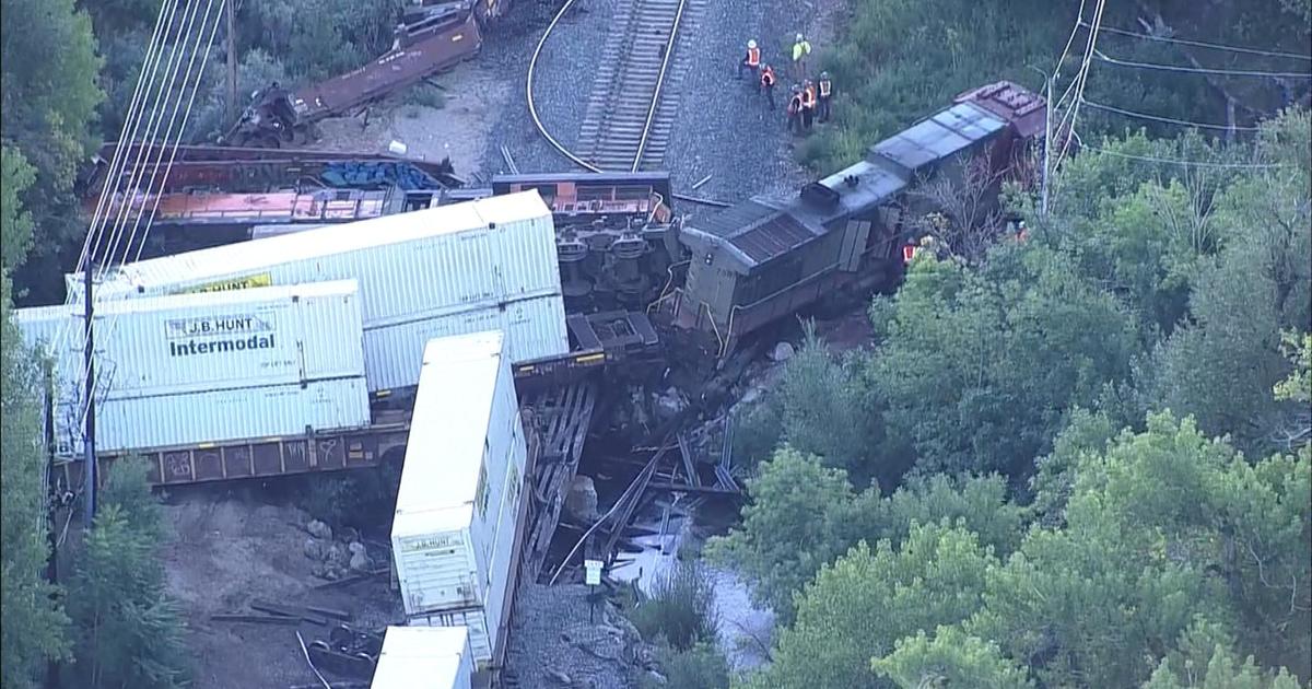 Freight train crash in Colorado destroys bridge and injures conductor; BNSF Railway investigates