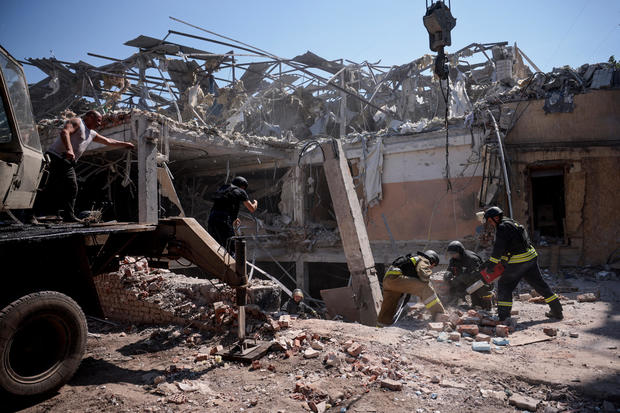 Ukrainian emergency personnel work among the rubble of a destroyed hotel following a Russian strike, in Kramatorsk 