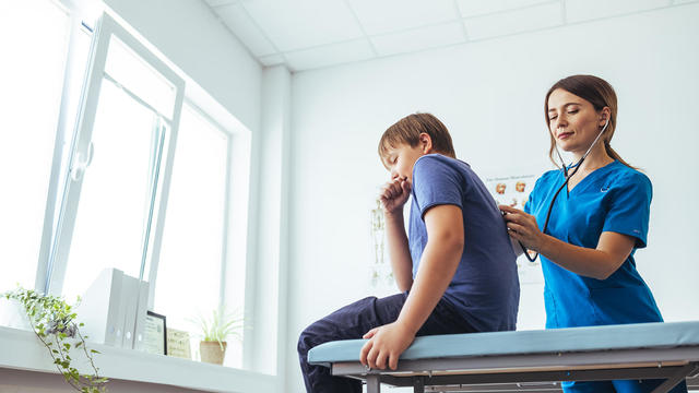 Female pediatrician having a check up on her patient 