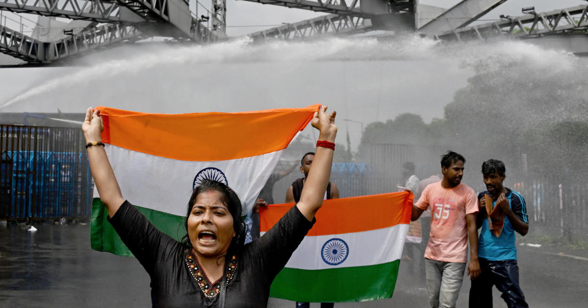 Police use water cannon and tear gas against demonstrators during renewed protests against the rape and murder of an Indian doctor