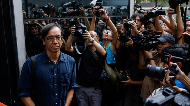 Chung Pui-kuen, former chief editor of the now-shuttered Stand News, leaves the district court on bail after the verdict in a landmark sedition trial in Hong Kong 