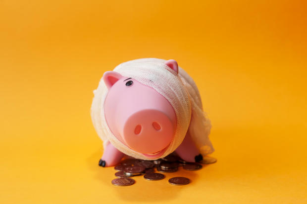 poor injured piggy bank toy 