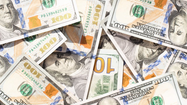 Dollars on a green background. Money. Currency. Inflation. World crisis. Pattern of dollar bills. 100 dollars. Financial minimalism. Exchange market. Money background.