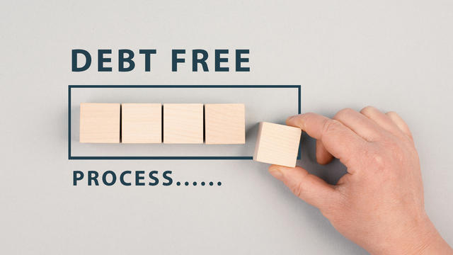 The words debt free in process are standing next to the loading bar, ending credit payments and bank loans, financial freedom 