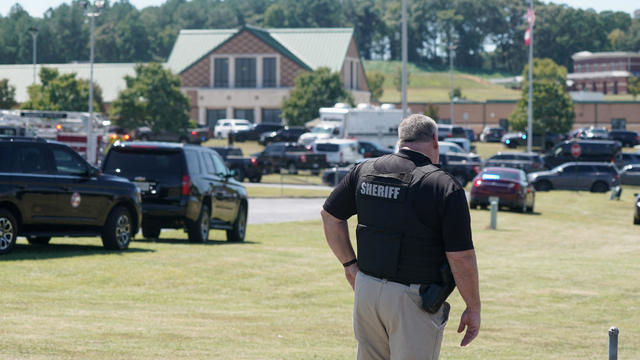 A law enforcement officer works near the scene of a shooting at Apalachee High School in Winder, Georgia, Sept. 4, 2024. 