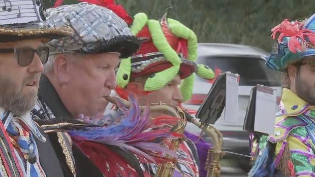 Mummers perform outside Sacred Heart Academy in Bryn Mawr 