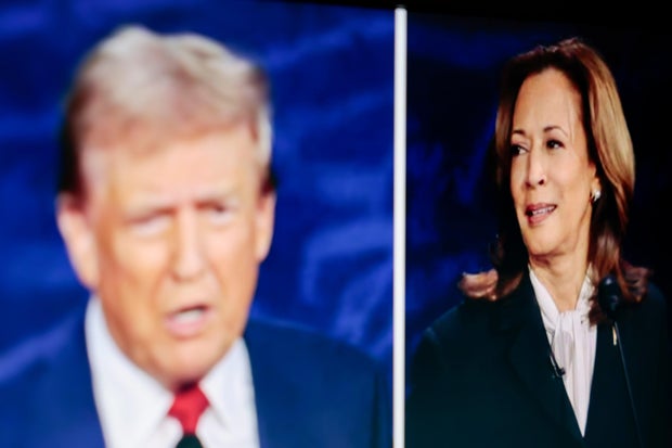 Former President Donald Trump and Vice President Kamala Harris are shown on screen in the spin room during the second presidential debate at the Pennsylvania Convention Center in Philadelphia, Pennsylvania, US, on Tuesday, Sept. 10, 2024.
