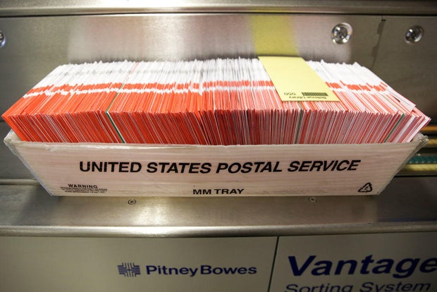 A box of ballots is pictured in a U.S. Postal Service box on Election Day at the King County Elections office in Renton, Washington, on Nov. 3, 2020.