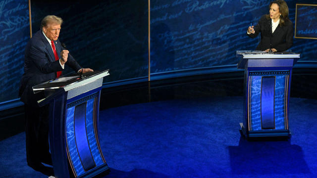 Trump and Harris speak and gesture during the debate 