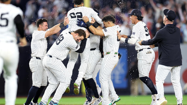 Juan Soto #22 of the New York Yankees reacts after a walk-off double against the Boston Red Sox during the tenth inning at Yankee Stadium on September 12, 2024 in the Bronx borough of New York City. 