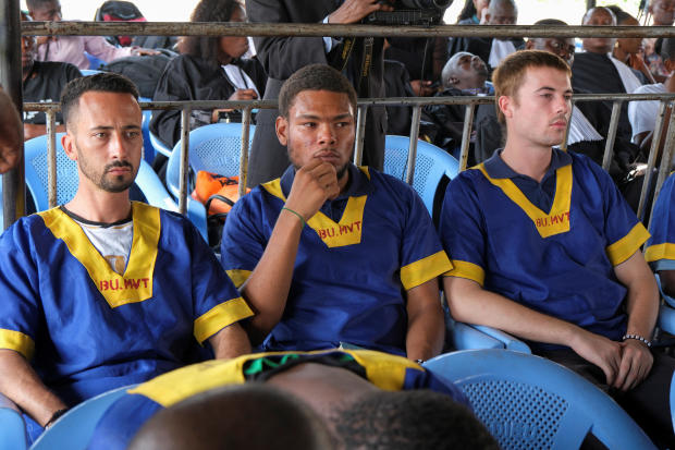 Benjamin Reuben Zalman-Polun, Marcel Malanga and Tyler Thompson, American citizens suspected along with a group of around 50 other people to be involved in an attempted coup in Congo, wait for the final verdict during their trial in Kinshasa, Congo, Sept. 13, 2024. 