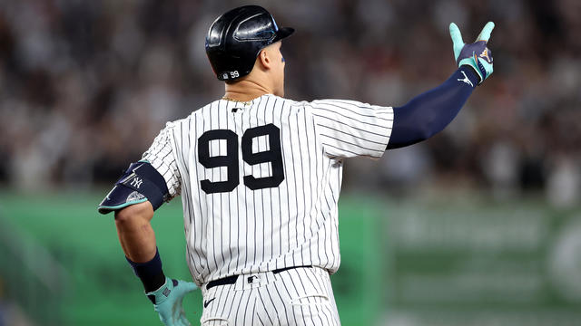 Aaron Judge #99 of the New York Yankees reacts after a grand slam against the Boston Red Sox during the seventh inning at Yankee Stadium on September 13, 2024 in the Bronx borough of New York City. 