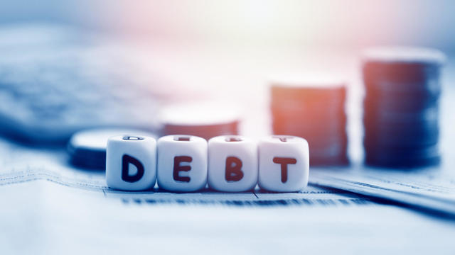 Debt credit card and money coin stack / Increased liabilities from exemption debt consolidation of financial crisis and problems risk business management loan interest 