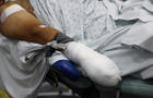 An injured man undergoes an operation, following pager detonations across Lebanon, at a hospital in Beirut 