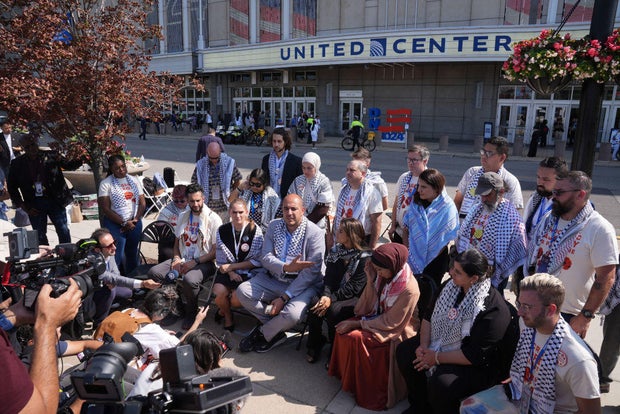 Uncommitted delegates protest in a sit-in outside on the final day of the Democratic National Convention at the United Center on Aug. 22, 2024, in Chicago.