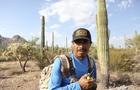 Roberto Resendiz, 48, reminds other members of the Armadillos via his walkie-talkie that Jose Luis Salinas Pineda was wearing black shoes and camo gear when he crossed the Arizona-Mexico border in early June. 