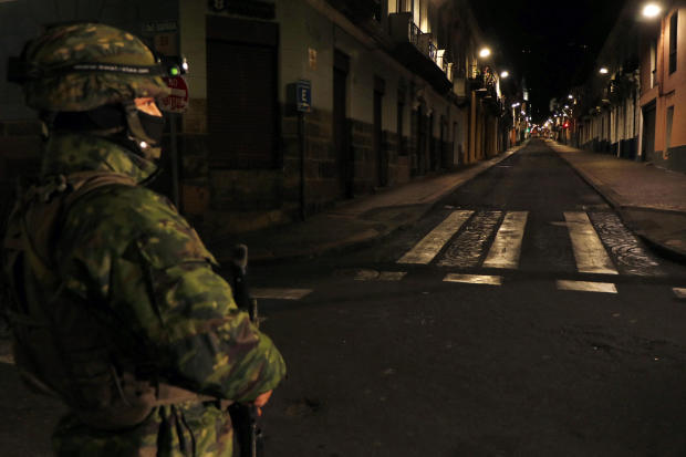 Ecuadorian police monitor a street during a national rationing of electricity due to maintenance on the transmission system and distribution networks, in Quito, Ecuador, Sept. 18, 2024. 