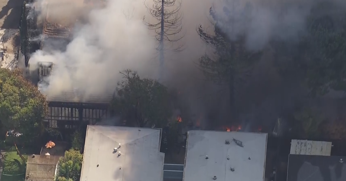 Redwood City rescue workers at the scene of a building fire