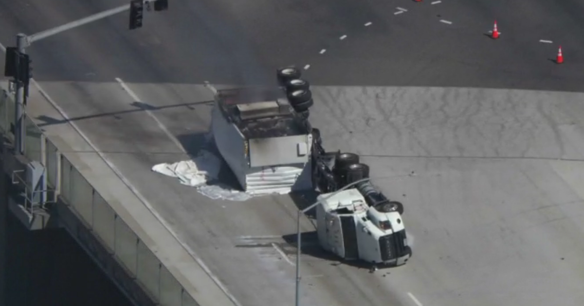 Hazmat investigators respond: 47 Freeway closed after large rig carrying lithium-ion batteries overturns in San Pedro