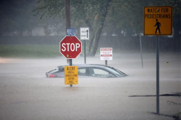 A stranded car sits in floodwaters as Tropical Storm Helene strikes, in Boone, North Carolina, Sept. 27, 2024. 