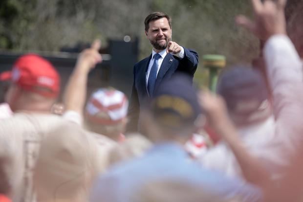 Senator and Republican vice presidential candidate J.D. Vance greets the crowd after speaking about the economy at Majestic Friesians Horse Farms in Big Rapids, Michigan, on August 27, 2024. 