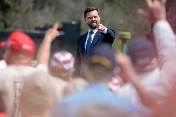 Senator and Republican vice presidential candidate J.D. Vance greets the crowd after speaking about the economy at Majestic Friesians Horse Farms in Big Rapids, Michigan, on August 27, 2024.