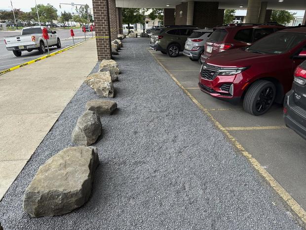 Large rocks are seen outside a building that houses the offices of the Luzerne County Bureau of Elections 