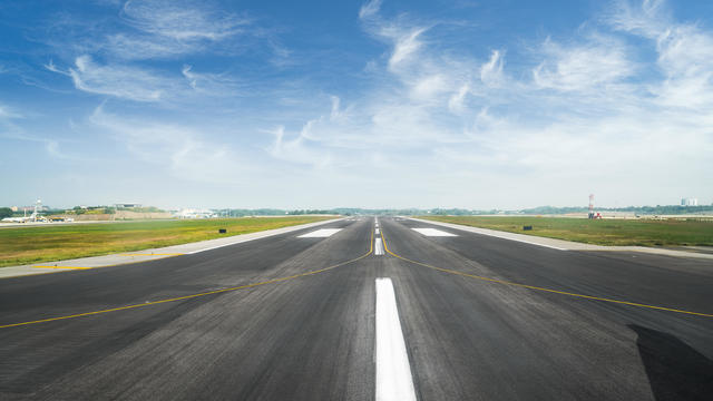 surface level of airport runway against sky 