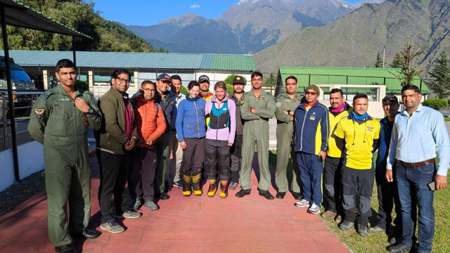 Rescued British and U.S. climbers pose for a photo with rescuers in Joshimath, Uttarakhand 