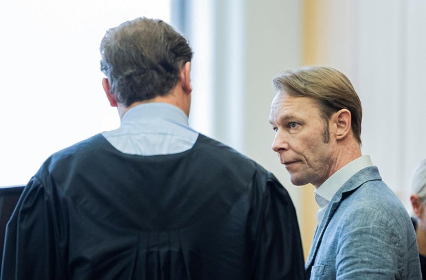 A man, who is a suspect in the disappearance of British toddler Madeleine McCann in Portugal, appears for trial on unrelated sexual assault charges in Germany