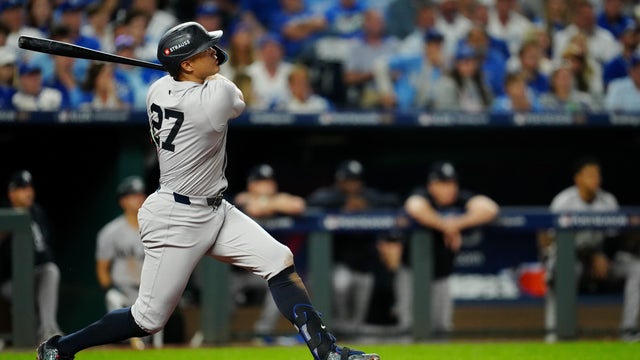 Giancarlo Stanton #27 of the New York Yankees hits a solo home run in the eighth inning during Game 3 of the Division Series presented by Booking.com between the New York Yankees and the Kansas City Royals at Kauffman Stadium on Wednesday, October 9, 2024 in Kansas City, Missouri. 