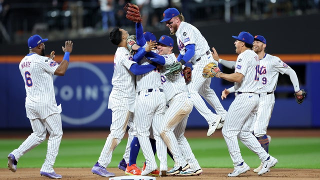 The New York Mets celebrate after beating the Philadelphia Phillies 4-1 in Game Four of the Division Series at Citi Field on October 09, 2024 in New York City. 