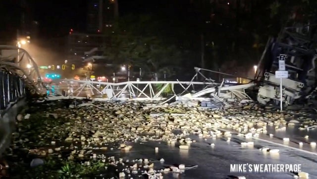 A crane collapses, during heavy rainfall and strong winds caused by Hurricane Milton, in St. Petersburg 