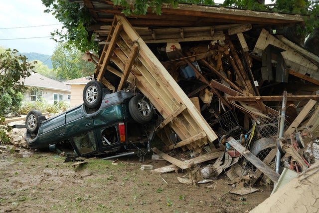 A damaged car sits under a destroyed shed after flooding caused by Hurricane Helene in Swannanoa, North Carolina, on Oct. 3, 2024.