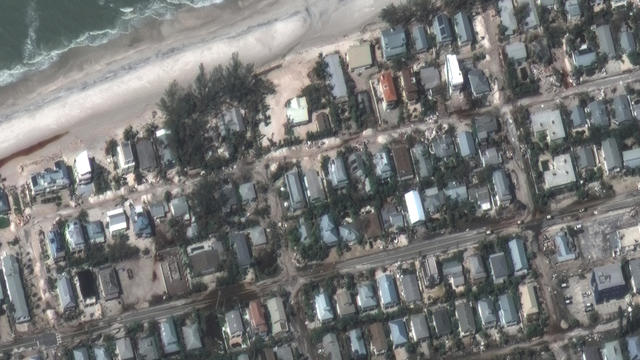 A satellite view shows sand and water on the streets after the passing of Hurricane Milton, in Holmes Beach, Anna Maria Island 