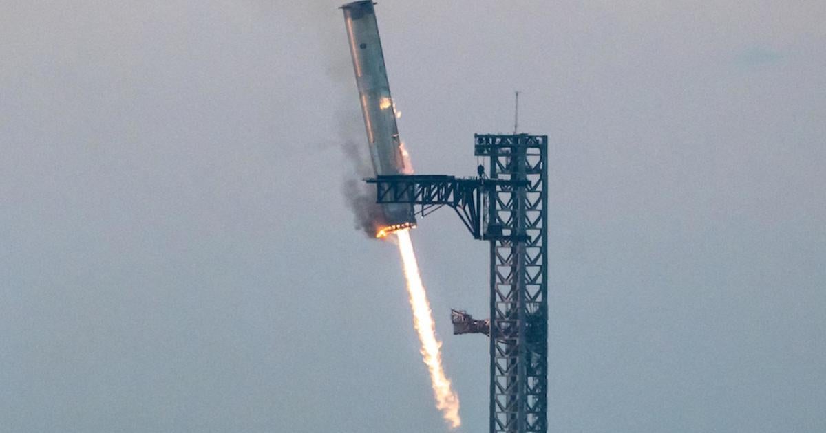 SpaceX catches rocket booster in dramatic landing