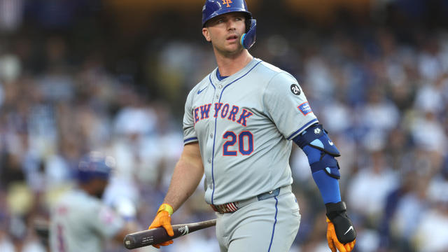 Pete Alonso #20 of the New York Mets walks back to the dugout after striking out in the second inning against the Los Angeles Dodgers during Game One of the Championship Series at Dodger Stadium on October 13, 2024 in Los Angeles, California. 