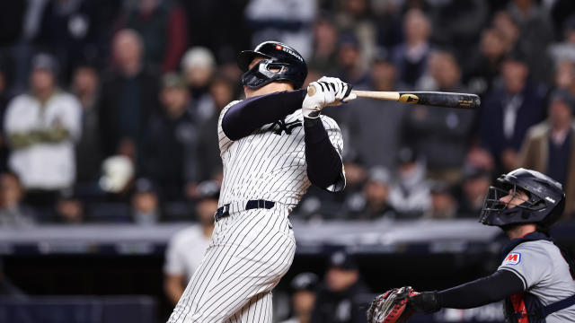 Aaron Judge #99 of the New York Yankees hits a two-run home run in the seventh inning during Game 2 of the ALCS presented by loanDepot between the Cleveland Guardians and the New York Yankees at Yankee Stadium on Tuesday, October 15, 2024 in New York, New York. 