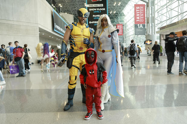 Cosplayers pose as Wolverine, Deadpool and Storm during New York Comic Con 2024 at The Jacob K. Javits Convention Center on October 17, 2024 in New York City. 