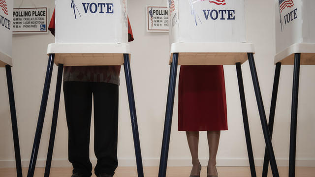 Voters voting in polling place 