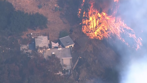 Oakland hills fire home threatened 